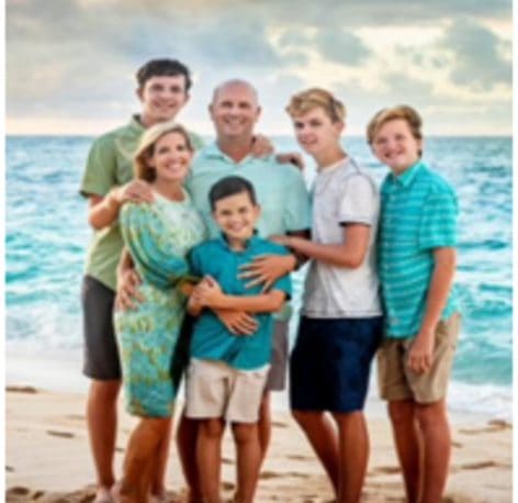 Dr. Travis Laney with his family on the beach